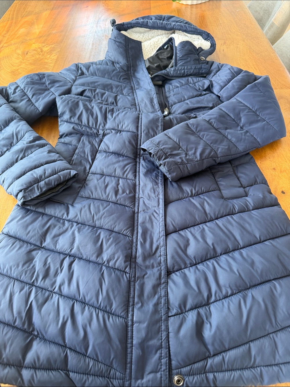 Superdry navy puffer jacket with cream sherpa hood lining and white logo